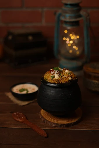 Rice dish served in a black handi