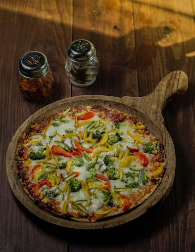 Vegetarian pizza served on a wooden platter