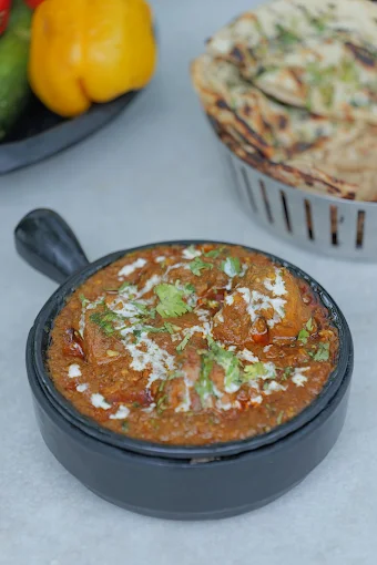 Paneer gravy served with Indian bread