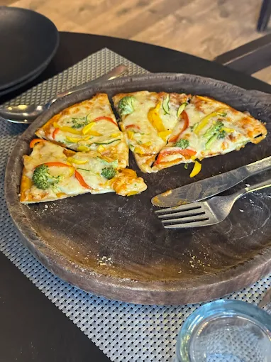 Pizza slices served on a wooden board