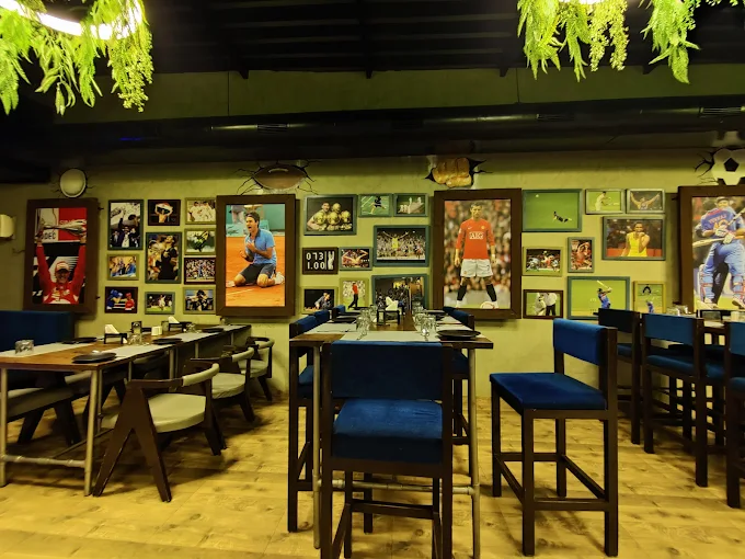 Sports-themed dining area at Hoppers